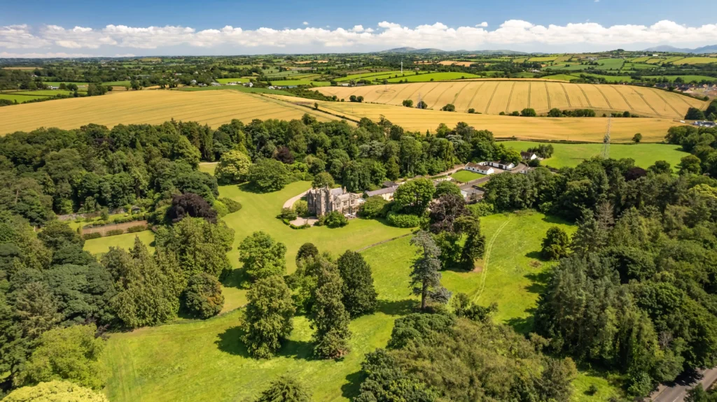 A fairy tale-like castle, Elmfield, built in 1850, is on the market for £3.35M. Nestled in Northern Ireland, this 90-acre estate offers historic charm and modern luxury.