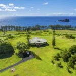 Hāna Ranch, a stunning 3,000-acre property in Maui, Hawaii, featuring ocean views, orchards, and equestrian facilities, is on the market for $75M, offering a serene, storybook setting.