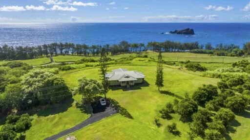 Hāna Ranch, a stunning 3,000-acre property in Maui, Hawaii, featuring ocean views, orchards, and equestrian facilities, is on the market for $75M, offering a serene, storybook setting.