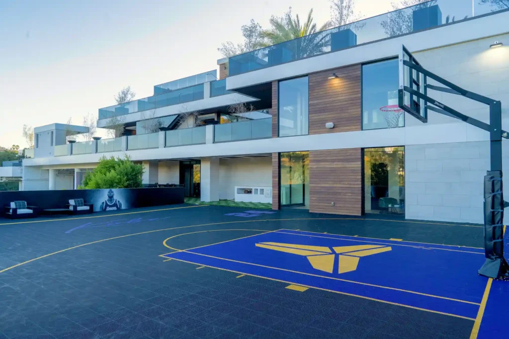 Luxury Brentwood estate "The Oasis" offers 20,000 sq ft of opulence with a Kobe Bryant-themed basketball court, car showroom, aquarium, and more, for $250K/month.