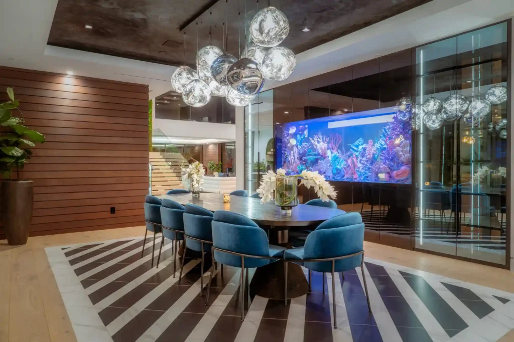 Luxury Brentwood estate "The Oasis" offers 20,000 sq ft of opulence with a Kobe Bryant-themed basketball court, car showroom, aquarium, and more, for $250K/month.