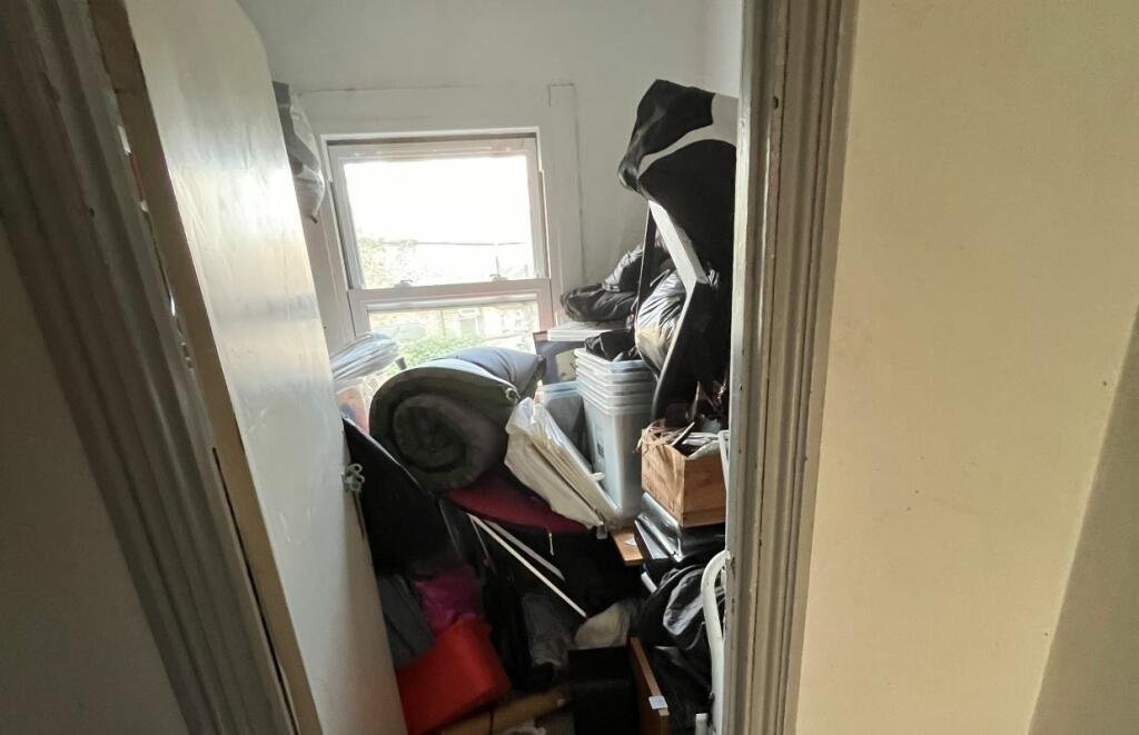 A 47-square-foot store room in Highbury, London, is up for auction for £15,000—billed as a "flat." Hidden costs and a 999-year lease make it a surprising deal for commuters.