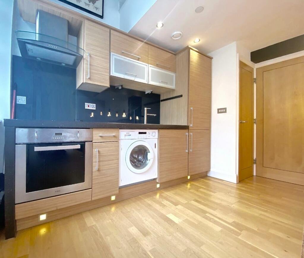 Unique Sheffield apartment with waterside views available for £725/month! Historic charm meets modern living, but watch out for the quirky low beam in the bedroom!