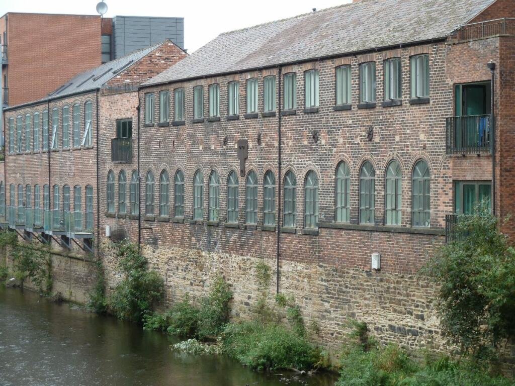 Unique Sheffield apartment with waterside views available for £725/month! Historic charm meets modern living, but watch out for the quirky low beam in the bedroom!