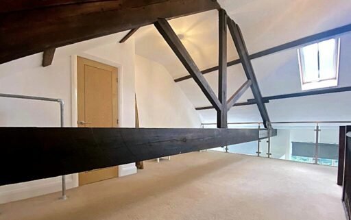 Unique Sheffield apartment with waterside views available for £725/month! Historic charm meets modern living, but watch out for the quirky low beam in the bedroom!