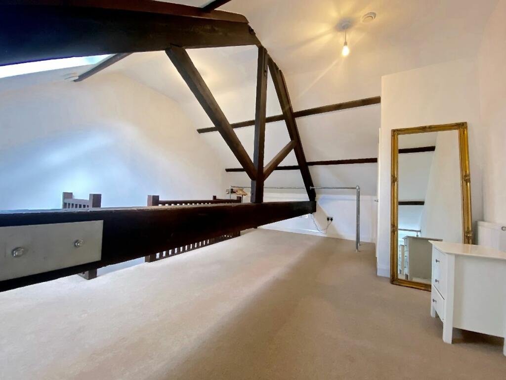 Unique Sheffield apartment with waterside views available for £725/month! Historic charm meets modern living, but watch out for the quirky low beam in the bedroom!