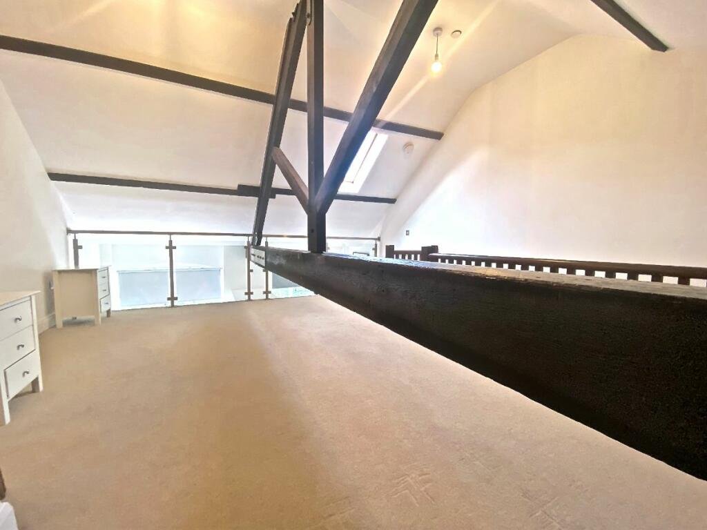 Unique Sheffield apartment with waterside views available for £725/month! Historic charm meets modern living, but watch out for the quirky low beam in the bedroom!