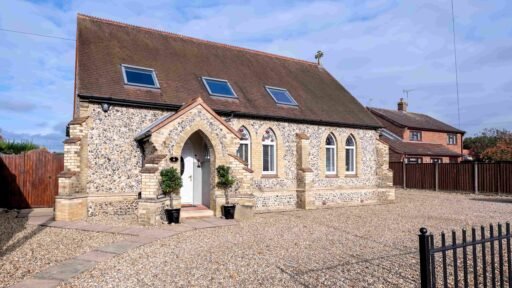 A stunning 19th-century converted chapel in Dereham, Norfolk, with Gothic windows, vaulted ceilings, and four bedrooms, is on the market for £625,000 with Fine & Country.