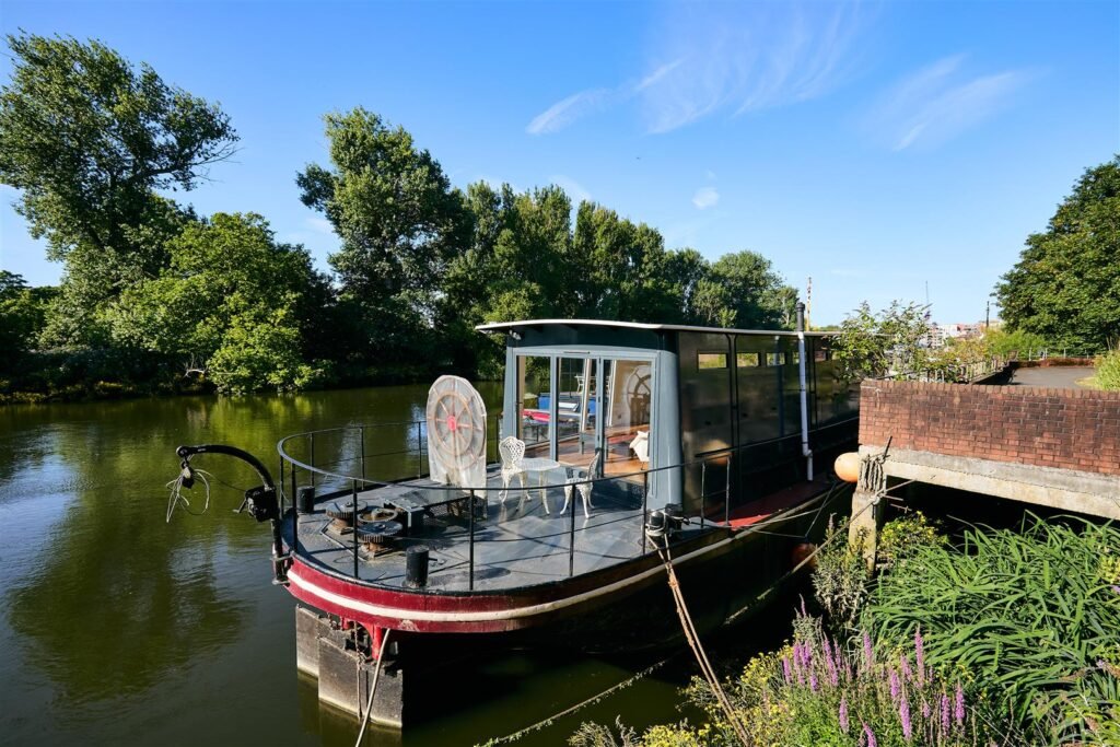 Luxury Dutch barge 'Big Ness' with chef-quality kitchen and river views is up for sale in Brentford’s Victoria Steps Quay for £1m, offering unique riverside living.