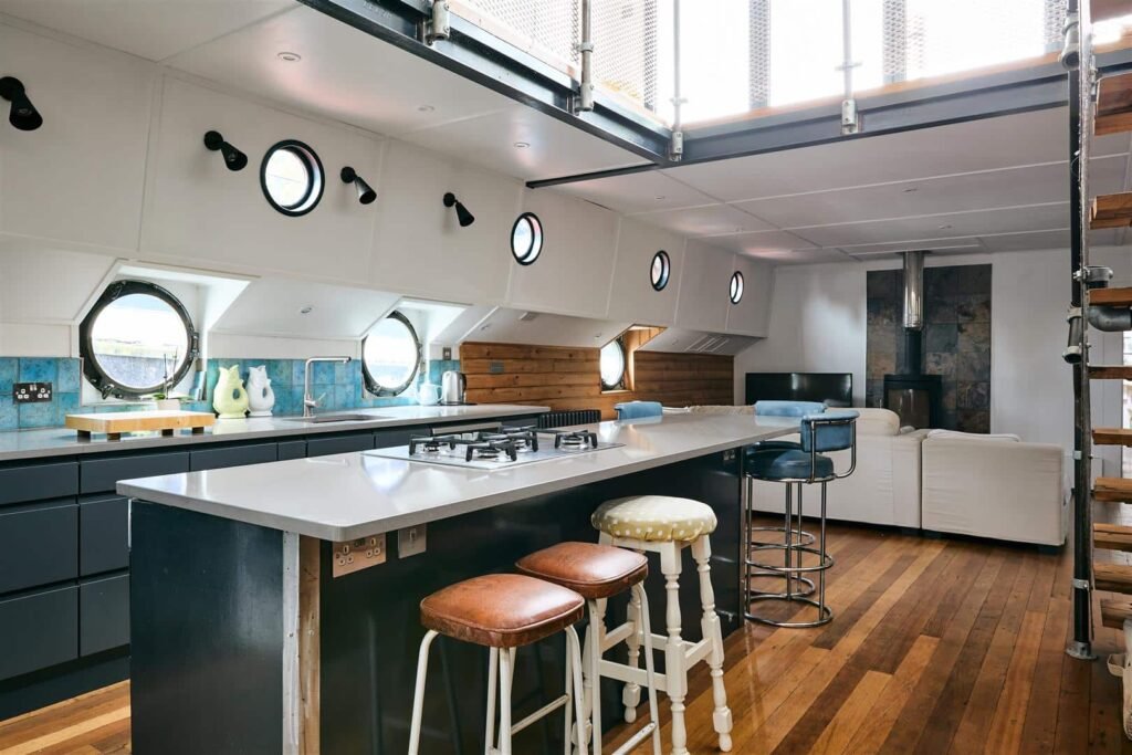 Luxury Dutch barge 'Big Ness' with chef-quality kitchen and river views is up for sale in Brentford’s Victoria Steps Quay for £1m, offering unique riverside living.