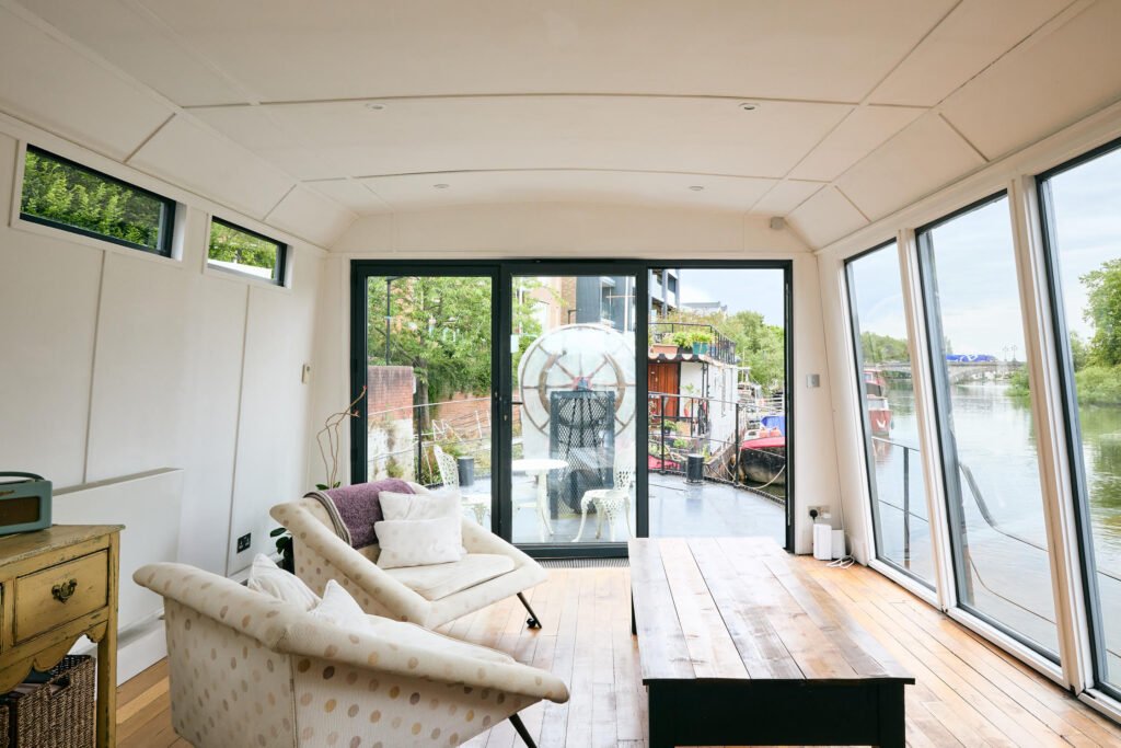 Luxury Dutch barge 'Big Ness' with chef-quality kitchen and river views is up for sale in Brentford’s Victoria Steps Quay for £1m, offering unique riverside living.