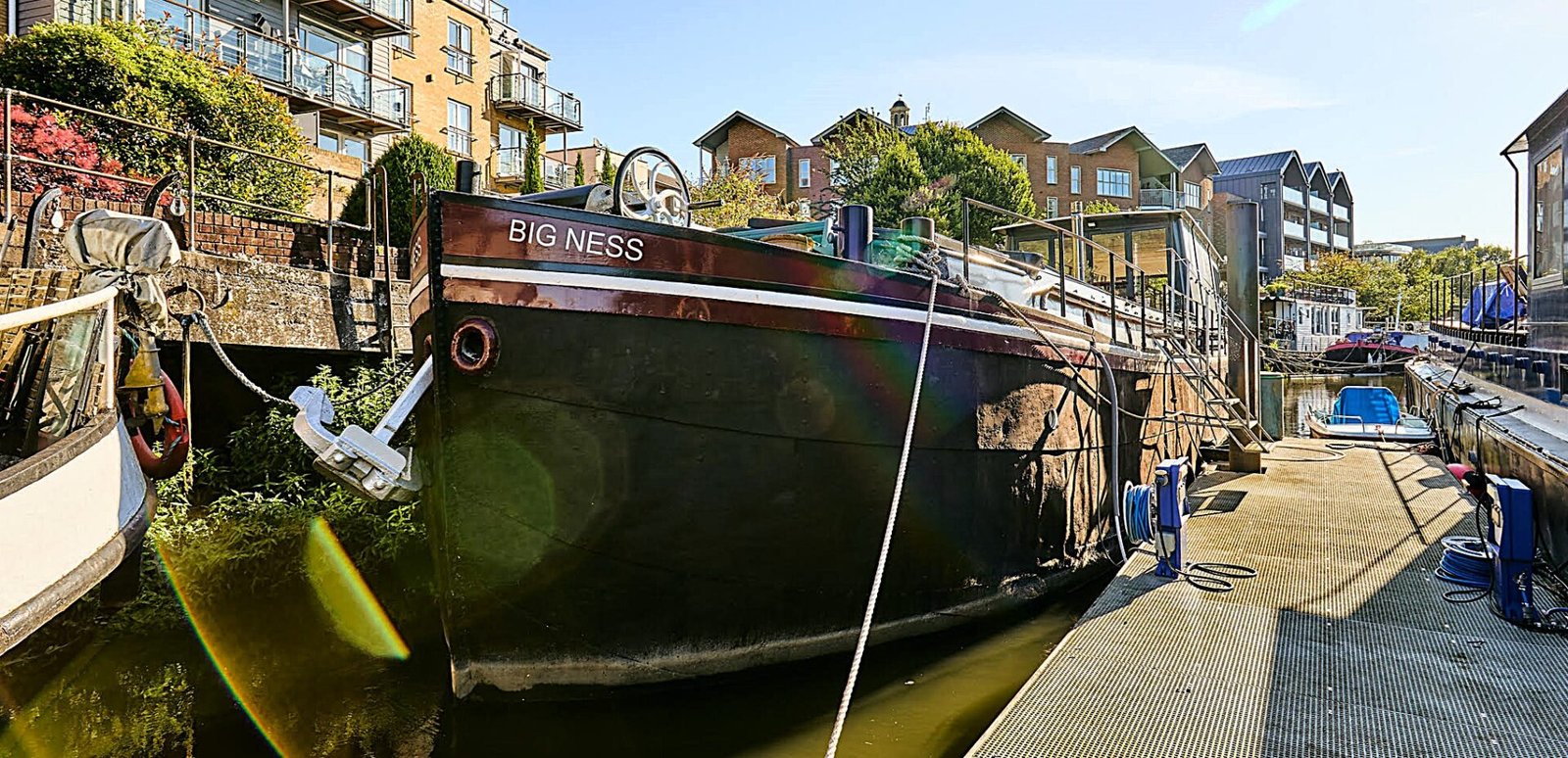 Luxury Dutch barge 'Big Ness' with chef-quality kitchen and river views is up for sale in Brentford’s Victoria Steps Quay for £1m, offering unique riverside living.