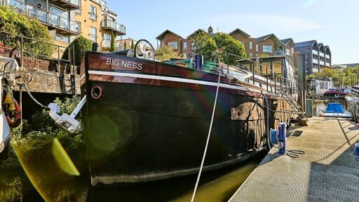 Luxury Dutch barge 'Big Ness' with chef-quality kitchen and river views is up for sale in Brentford’s Victoria Steps Quay for £1m, offering unique riverside living.