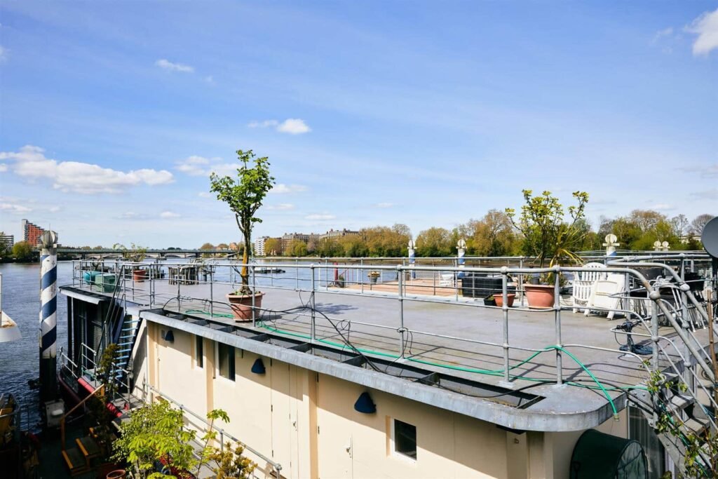 Luxury 5-bedroom houseboat with fireplace, 3 open decks, and stunning Thames views hits the market in London for £1.8m. Moored at Prospect Quay, it's a unique riverside gem.