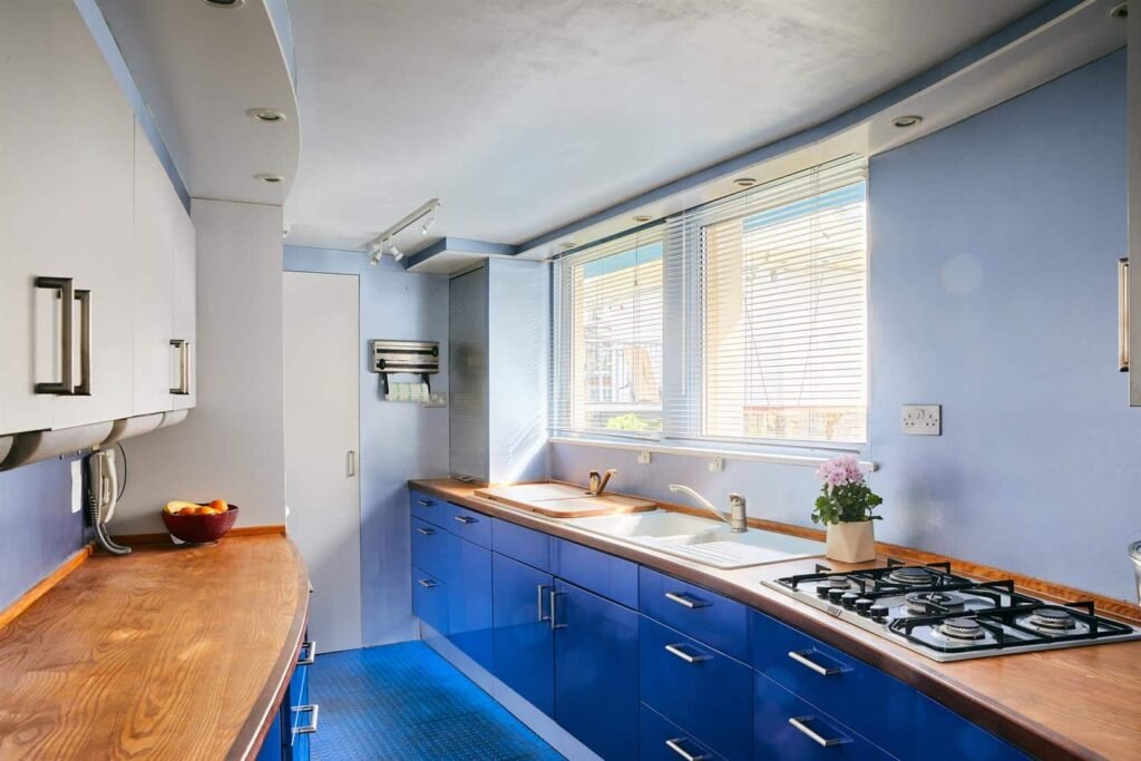 Luxury 5-bedroom houseboat with fireplace, 3 open decks, and stunning Thames views hits the market in London for £1.8m. Moored at Prospect Quay, it's a unique riverside gem.