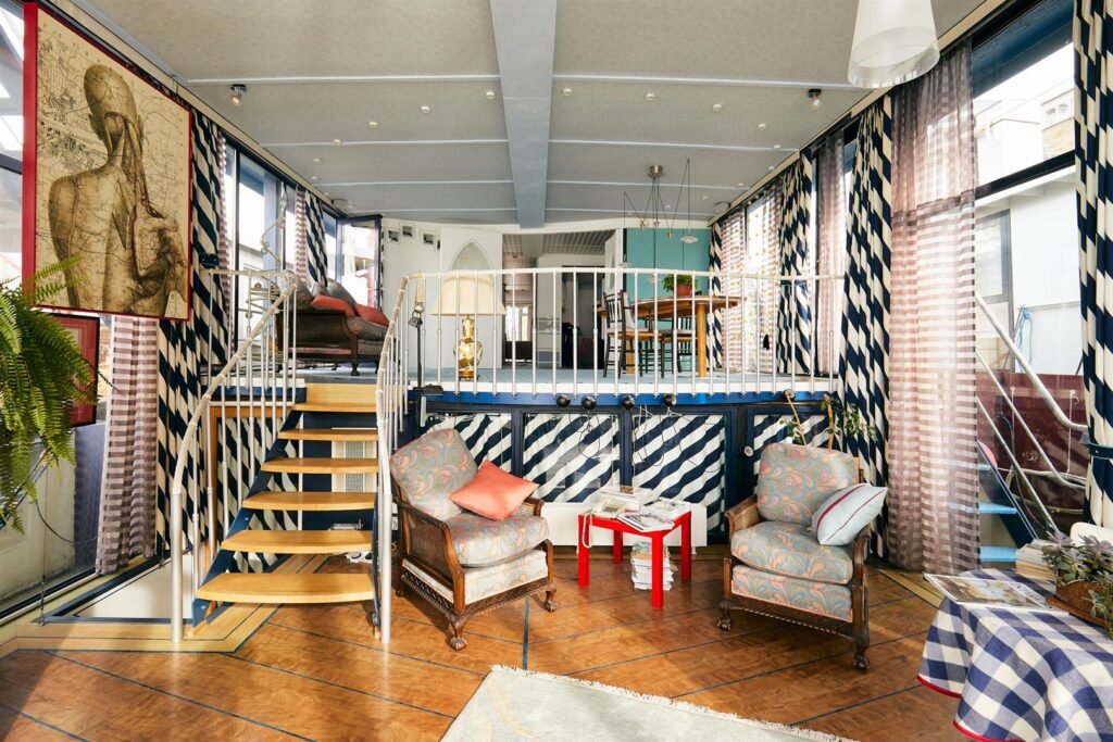 Luxury 5-bedroom houseboat with fireplace, 3 open decks, and stunning Thames views hits the market in London for £1.8m. Moored at Prospect Quay, it's a unique riverside gem.