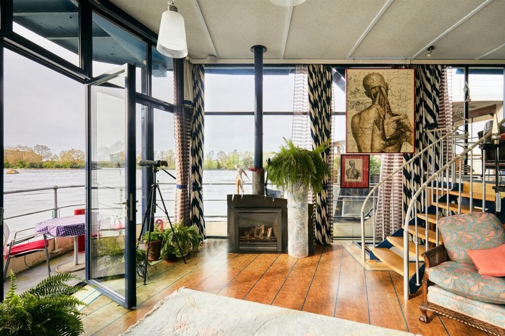 Luxury 5-bedroom houseboat with fireplace, 3 open decks, and stunning Thames views hits the market in London for £1.8m. Moored at Prospect Quay, it's a unique riverside gem.