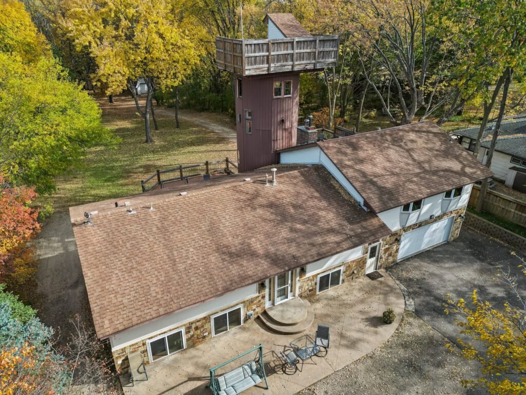 Unique home of Rollerblade inventor Scott Olson hits the market in Minnesota for $599K, featuring a star-gazing silo, mini sports court, and scenic creek views.