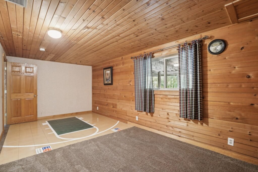 Unique home of Rollerblade inventor Scott Olson hits the market in Minnesota for $599K, featuring a star-gazing silo, mini sports court, and scenic creek views.