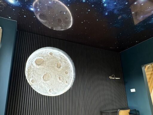 Property investor’s £50,000 renovation of a student house sparks debate, featuring a ‘Moon Room’ with LED-lit moon and starry ceiling to redefine student housing.