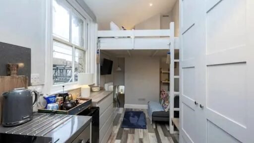 Brighton studio flat likened to a "cupboard" hits the market for £160,000. Tiny mezzanine bed area and open-plan kitchen just seconds from the sea spark reactions.