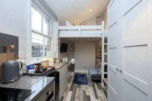 Brighton studio flat likened to a "cupboard" hits the market for £160,000. Tiny mezzanine bed area and open-plan kitchen just seconds from the sea spark reactions.