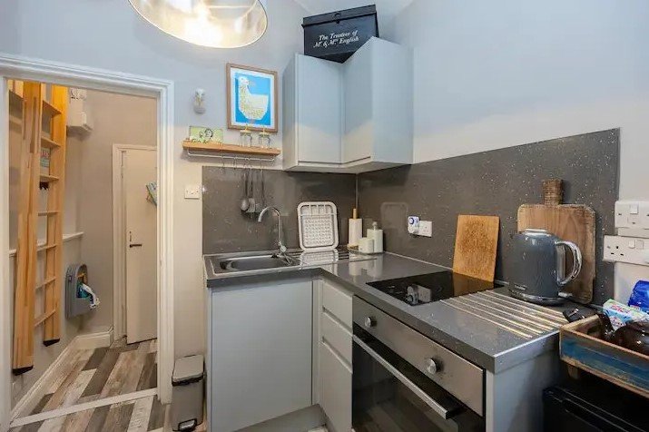 Brighton studio flat likened to a "cupboard" hits the market for £160,000. Tiny mezzanine bed area and open-plan kitchen just seconds from the sea spark reactions.