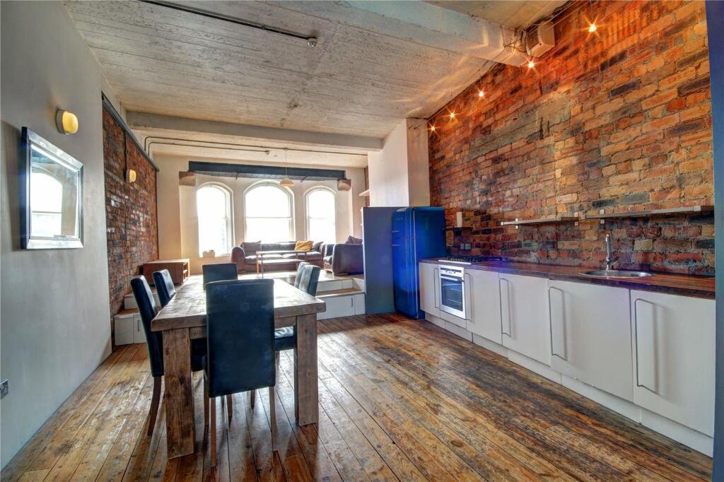 Bizarre Newcastle studio with a pod-style bed hanging from the ceiling still unsold after a £20k price drop. Modern design, Tyne Bridge views, £210k.