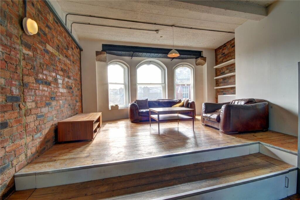 Bizarre Newcastle studio with a pod-style bed hanging from the ceiling still unsold after a £20k price drop. Modern design, Tyne Bridge views, £210k.