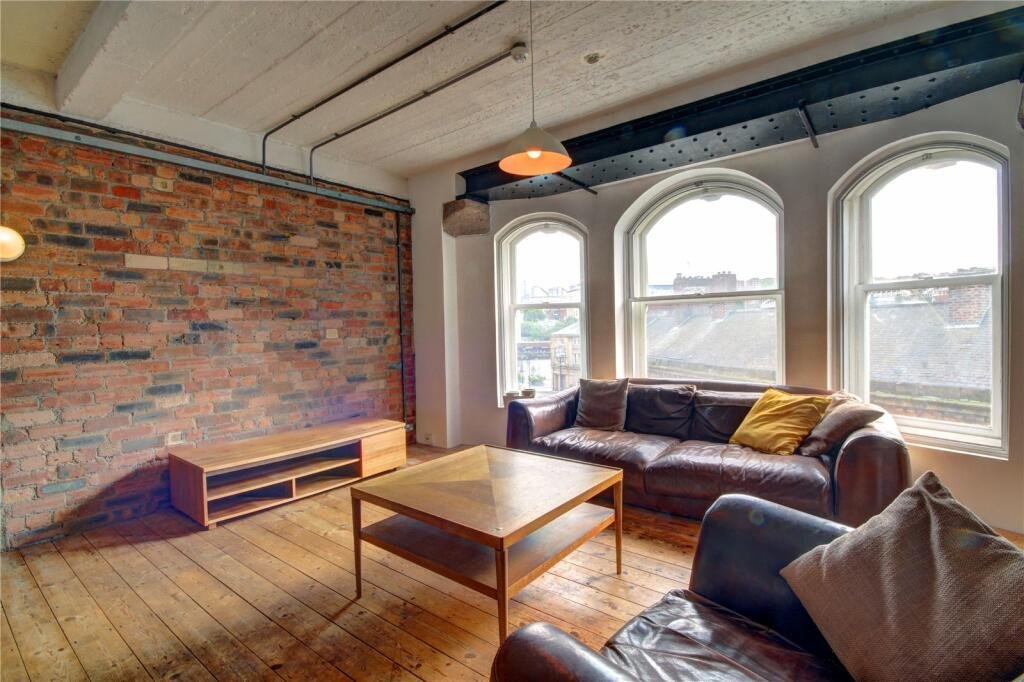 Bizarre Newcastle studio with a pod-style bed hanging from the ceiling still unsold after a £20k price drop. Modern design, Tyne Bridge views, £210k.