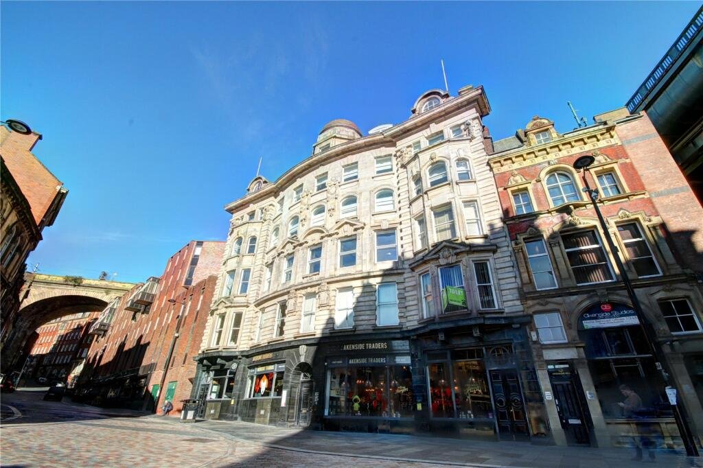 Bizarre Newcastle studio with a pod-style bed hanging from the ceiling still unsold after a £20k price drop. Modern design, Tyne Bridge views, £210k.