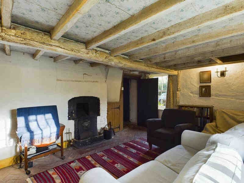 A rare 18th-century mud and stud cottage in Little Steeping, Lincolnshire, is on the market for £220k. With a thatched roof and period charm, it’s a portal to the past!