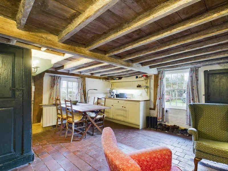 A rare 18th-century mud and stud cottage in Little Steeping, Lincolnshire, is on the market for £220k. With a thatched roof and period charm, it’s a portal to the past!