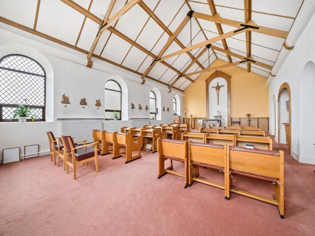 A stunning 27-bedroom former nunnery with sea views in Fishguard, South Wales, is on the market for £750,000. The property includes a chapel, cottages, and panoramic harbor views.