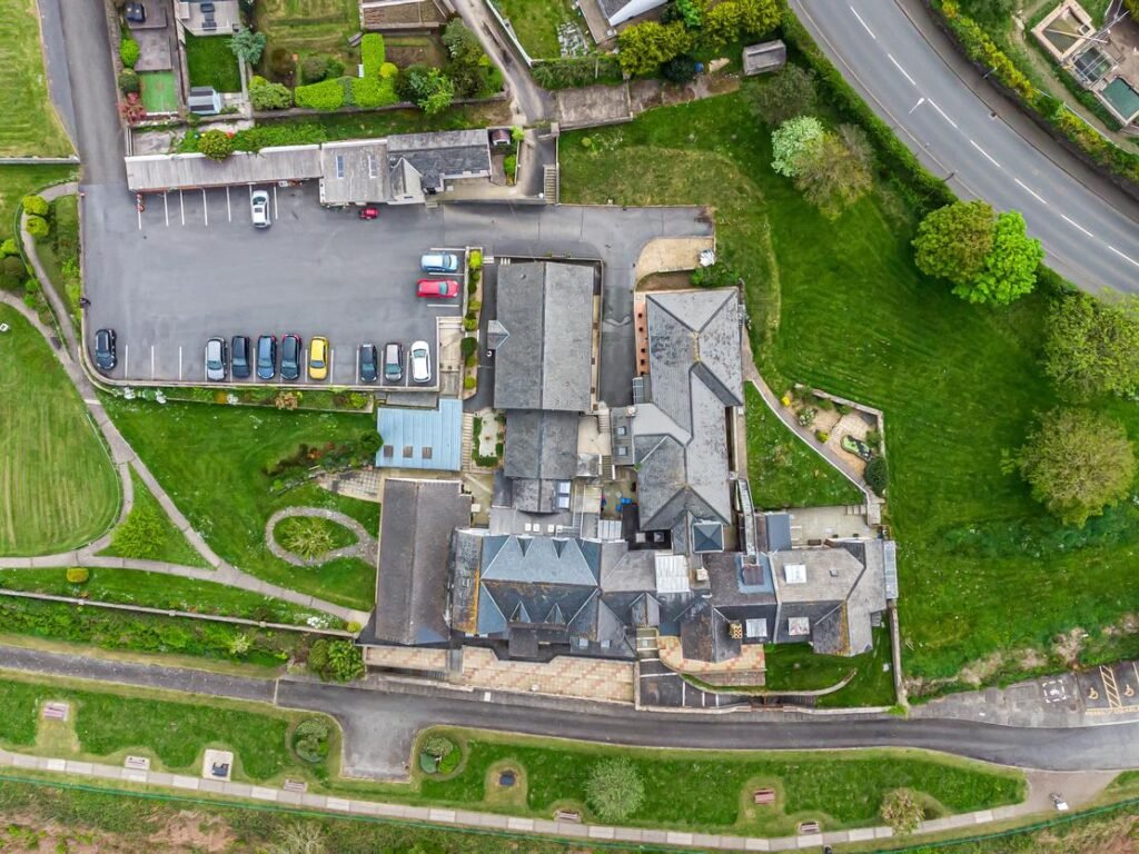 A stunning 27-bedroom former nunnery with sea views in Fishguard, South Wales, is on the market for £750,000. The property includes a chapel, cottages, and panoramic harbor views.