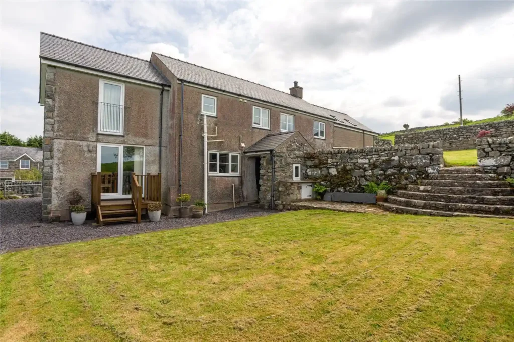 A stunning four-bedroom farmhouse with panoramic views of Snowdonia's Moelwynion mountains and the Llyn Peninsula is for sale at £775,000, offering rural bliss in Wales.