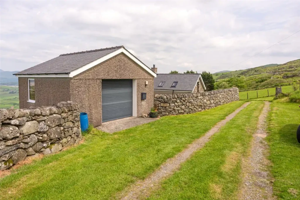 A stunning four-bedroom farmhouse with panoramic views of Snowdonia's Moelwynion mountains and the Llyn Peninsula is for sale at £775,000, offering rural bliss in Wales.