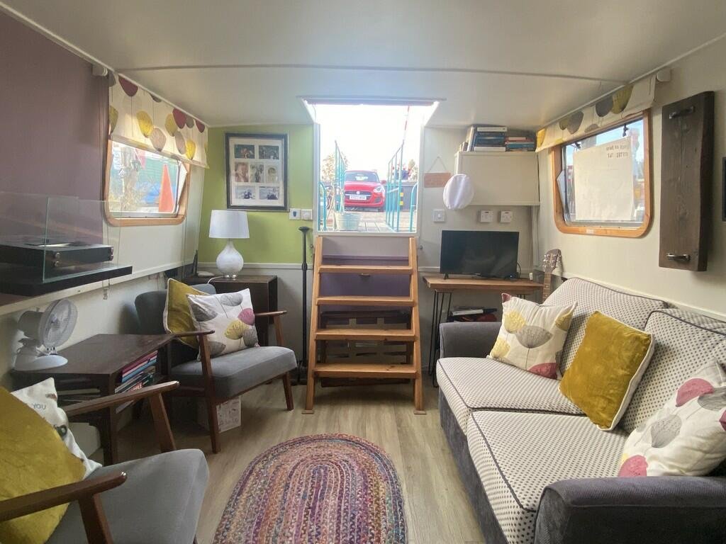 Escape the January blues in Woodbridge, Britain’s happiest place to live, with a charming two-bedroom houseboat, Ray of Sunshine, for just £119,000—tranquility included!