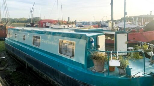 Escape the January blues in Woodbridge, Britain’s happiest place to live, with a charming two-bedroom houseboat, Ray of Sunshine, for just £119,000—tranquility included!