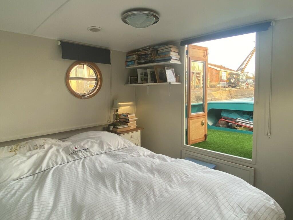 Escape the January blues in Woodbridge, Britain’s happiest place to live, with a charming two-bedroom houseboat, Ray of Sunshine, for just £119,000—tranquility included!