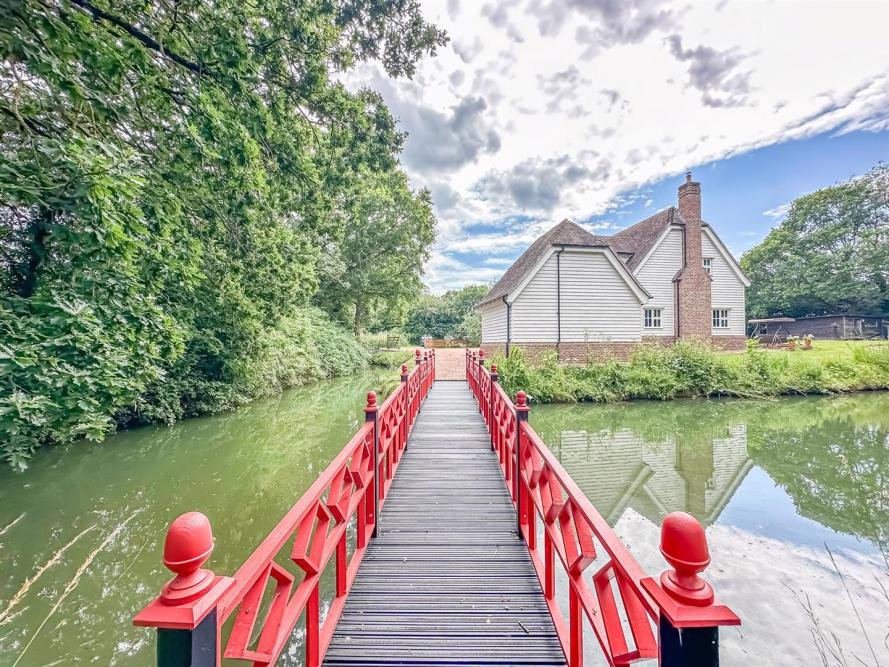 Unique 4-bed home with 3 fishing lakes on 7 acres in Rayleigh, Essex, offers tranquil living and a thriving business opportunity, now on sale for £1.6M.