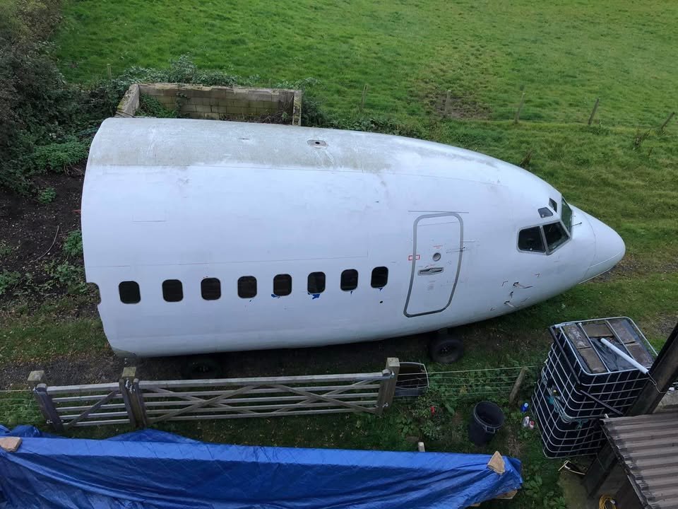 Boeing 737 cockpit on sale for £25K. Ex-RAF engineer planned to turn it into a glamping pod - now up for grabs for aviation buffs, bars, classrooms, or man caves.