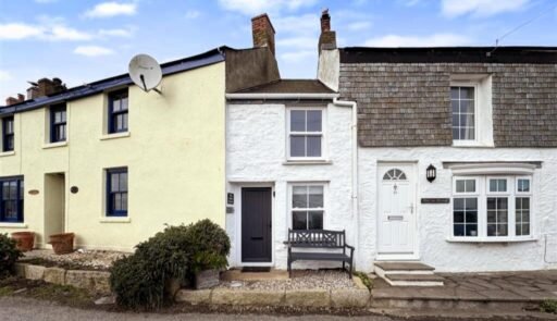 One of Britain's narrowest homes, The Doll's House in Porthleven, Cornwall, is for sale at £235,000 - offering stunning sea views and a charming coastal retreat.