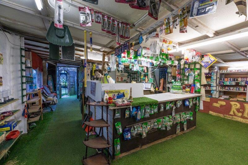 A quirky bungalow in Wigan with its own garden centre and whimsical decor is on the market for £495,000 - offering unique living space and exciting development potential.