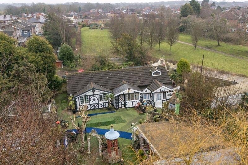 A quirky bungalow in Wigan with its own garden centre and whimsical decor is on the market for £495,000 - offering unique living space and exciting development potential.