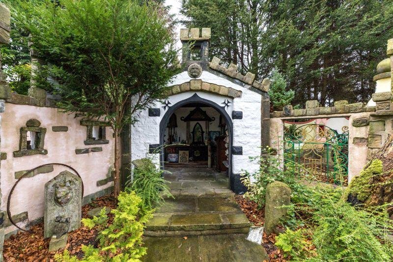 A quirky bungalow in Wigan with its own garden centre and whimsical decor is on the market for £495,000 - offering unique living space and exciting development potential.