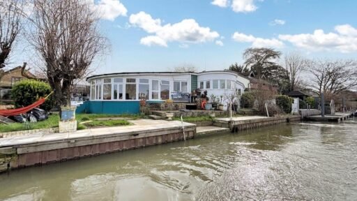 A unique £525,000 bungalow on a private island in Wraysbury near London offers stunning River Thames views - accessible only by boat and featuring a spacious circular layout.