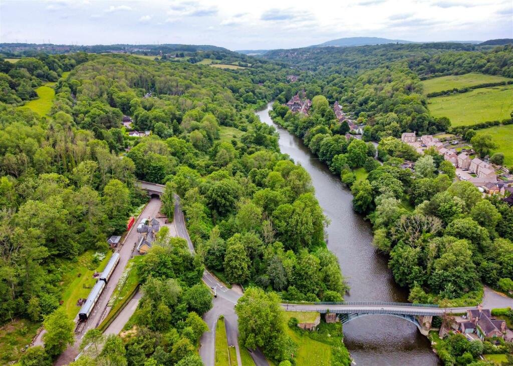 A converted Victorian railway station with vintage train carriages is for sale in Shropshire for £975,000 - a unique home and business earning £45,000 in 10 weeks.