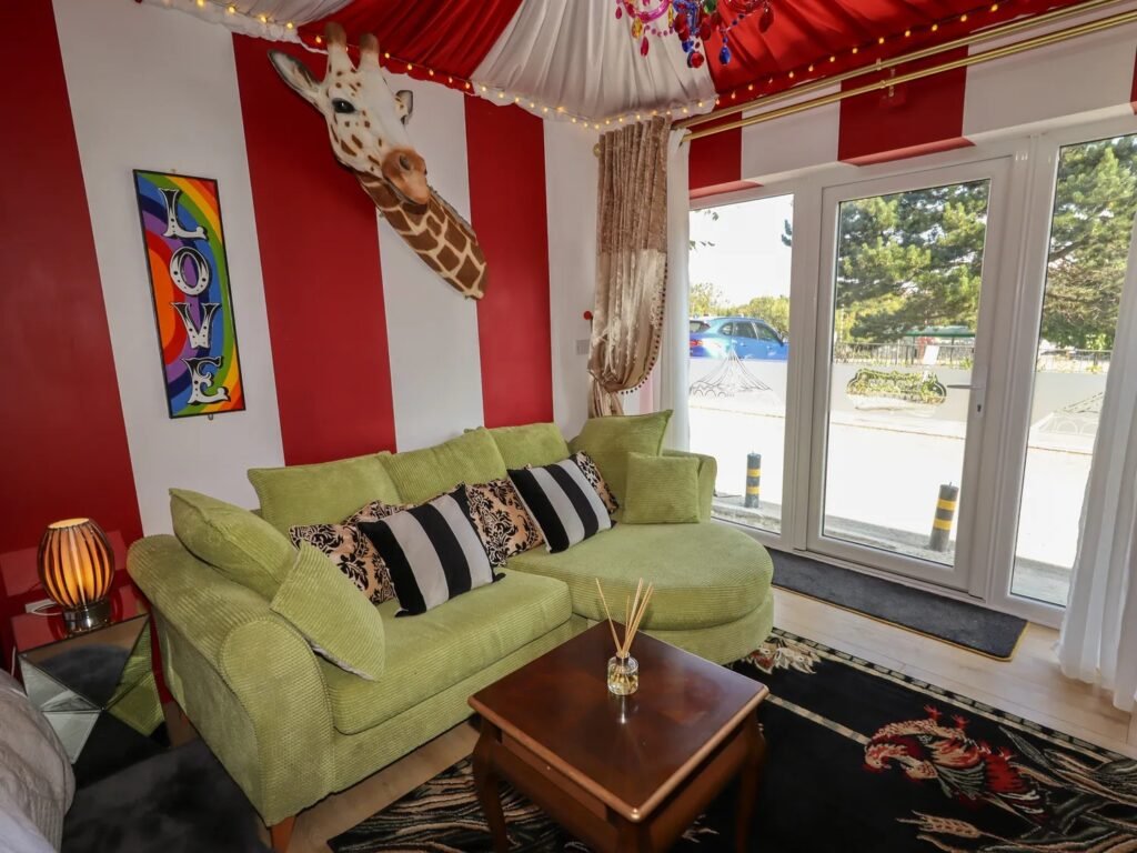 A retired nurse transformed a holiday home in Wales into a circus-themed retreat, complete with striped walls and vintage décor, delighting guests with its playful charm.