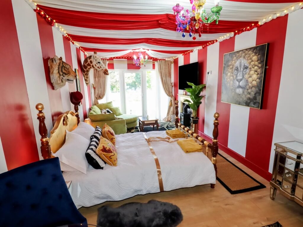 A retired nurse transformed a holiday home in Wales into a circus-themed retreat, complete with striped walls and vintage décor, delighting guests with its playful charm.